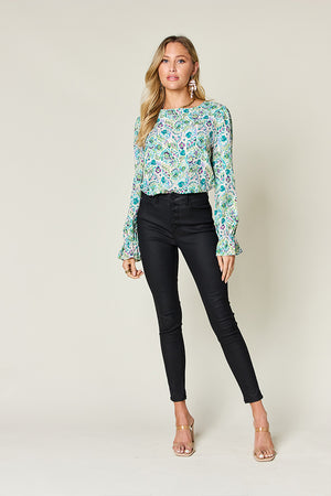 Painterly print blouse in sky blue with gathered sleeves and a crew neck.