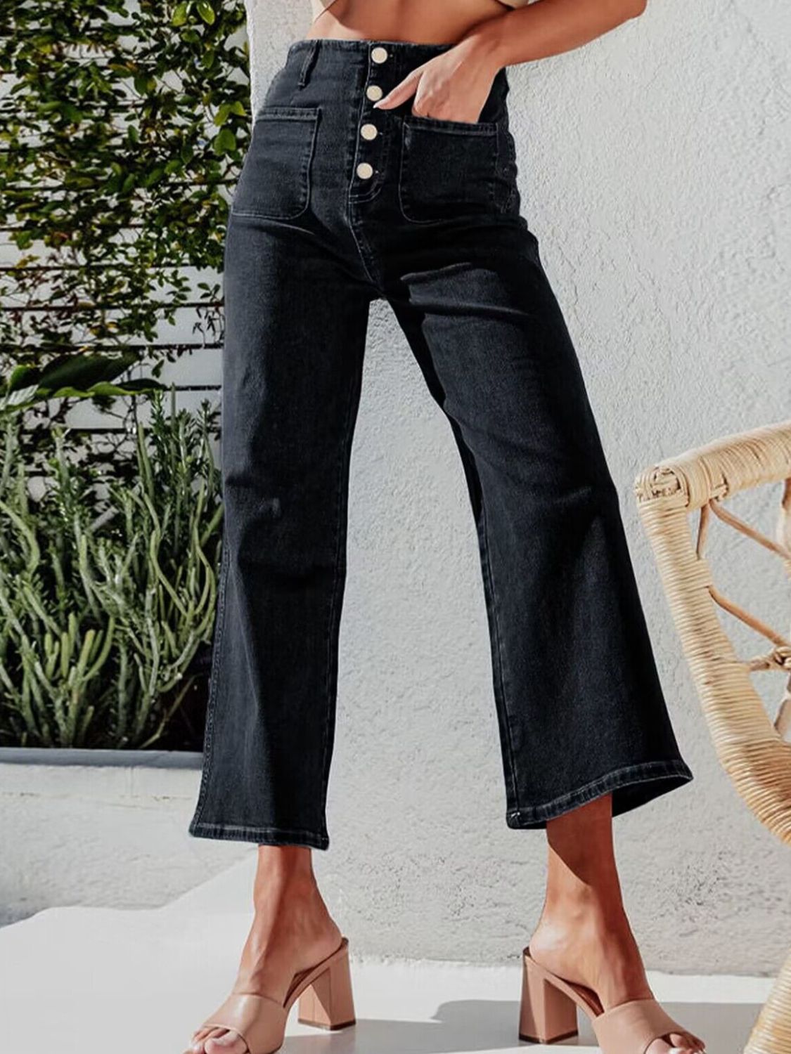 Black button-front wide-leg cropped jeans with a high waist and utility pockets.