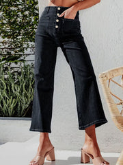 Black button-front wide-leg cropped jeans with a high waist and utility pockets.