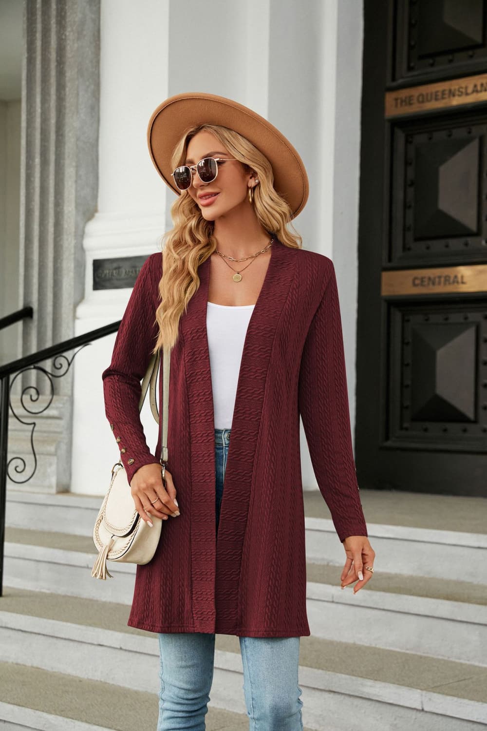 Burgundy textured knit open-front duster cardigan with button cuff detail.