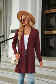 Burgundy textured knit open-front duster cardigan with button cuff detail.