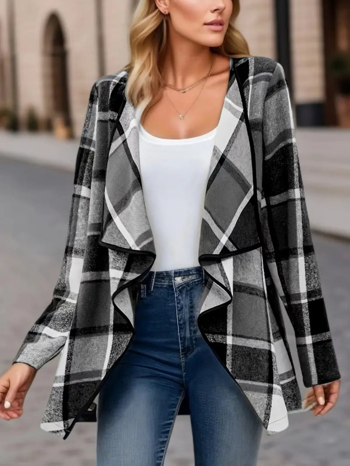 Asymmetric plaid drape front jacket in black and white, open front, waterfall lapel.