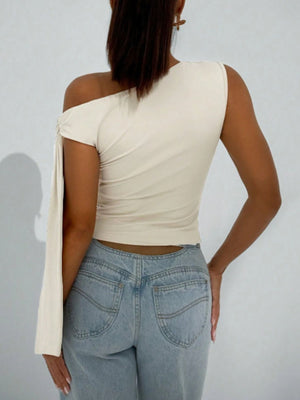 Apricot asymmetrical tie detail cropped blouse with one shoulder and draped sleeve.