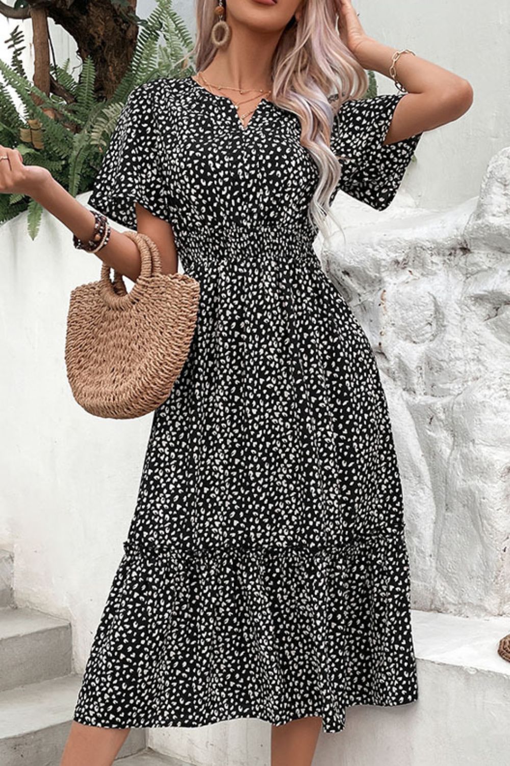 Black floral print midi dress with smocked waist and flutter sleeves