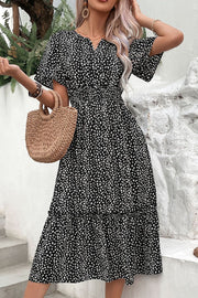 Black floral print midi dress with smocked waist and flutter sleeves
