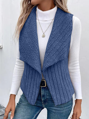Textured teddy collarless vest in Dusty Blue with ribbed detail and open front.