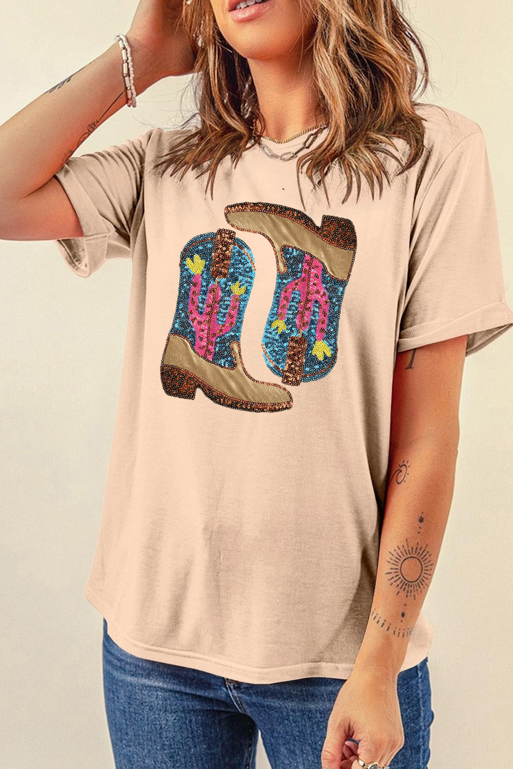 Eggshell cotton graphic tee with sequin desert boots and cactus print.