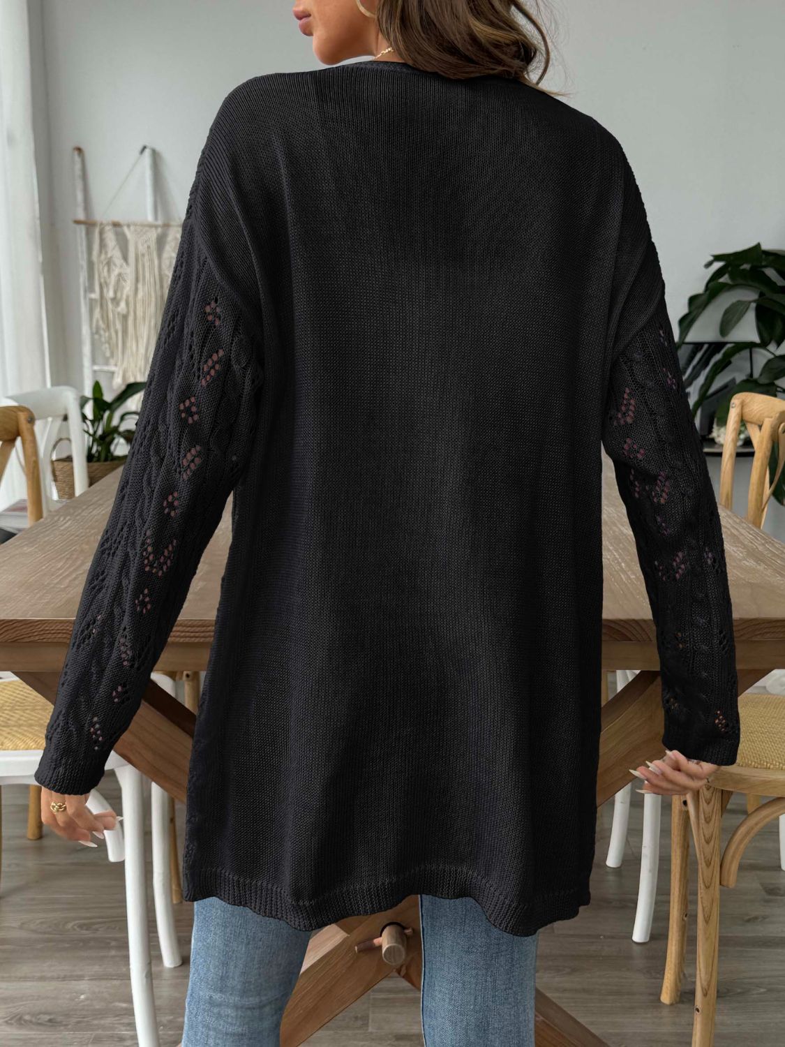Black openwork diamond knit duster cardigan with long sleeves and a relaxed fit.