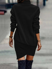 Black turtleneck mini dress with asymmetrical hem and long sleeves