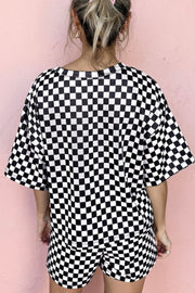 Black and white checkered loungewear set with short sleeves and shorts.