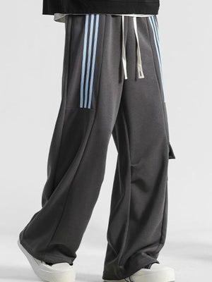 Men's gray loose-fit sweatpants with light blue side stripes and drawstring.