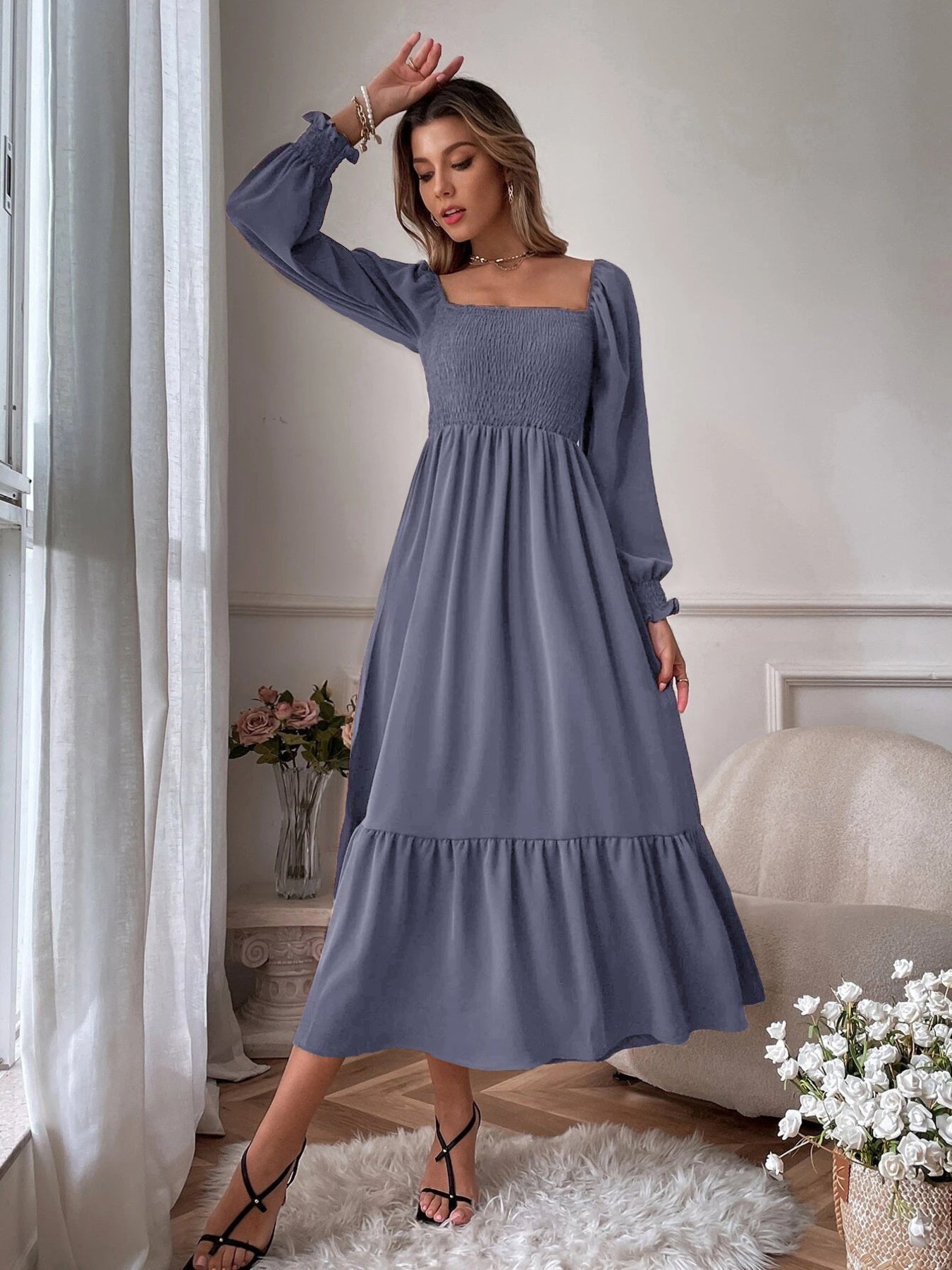 Smocked midi dress in dusty blue with square neck, puff sleeves, and tiered hem.