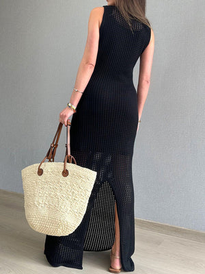 Black open-knit column dress with side slit and crew neckline.