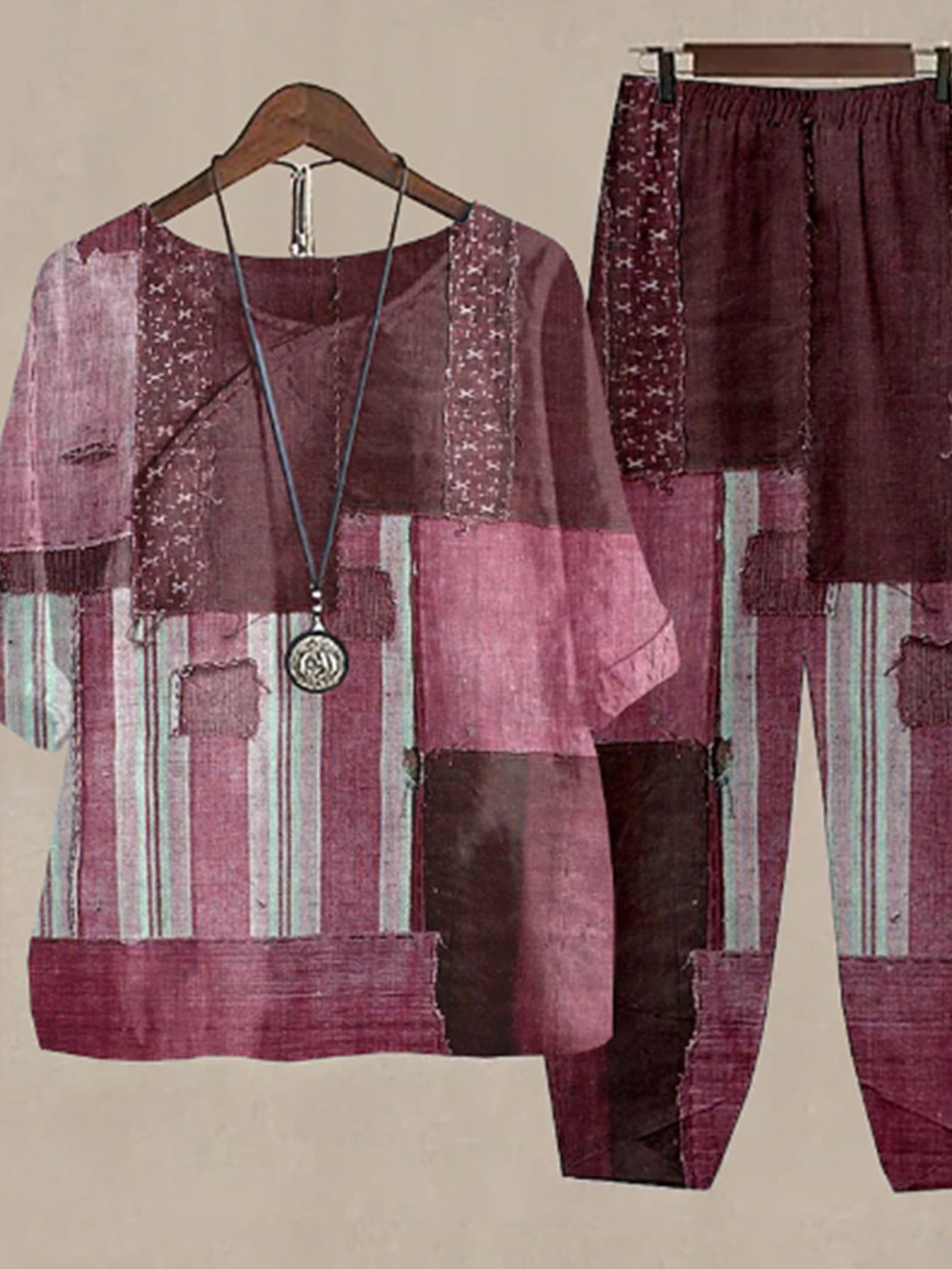 Plum purple floral print half sleeve top and pants set with patchwork details.
