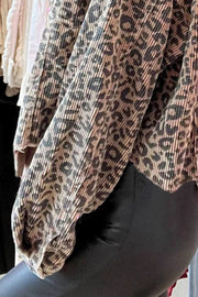 Corded leopard print cropped jacket with textured fabric and balloon sleeves.