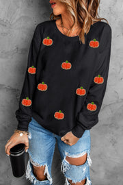 Black sweatshirt with allover embroidered pumpkins, crew neck, long sleeves.