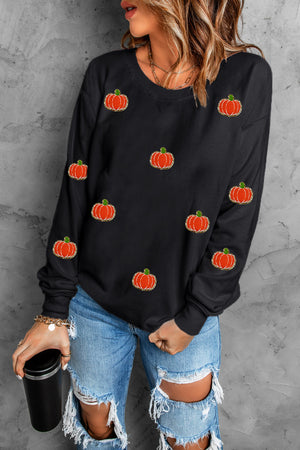 Black sweatshirt with allover embroidered pumpkins, crew neck, long sleeves.