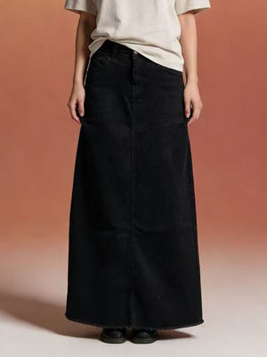 Black denim maxi skirt with raw hem and button closure