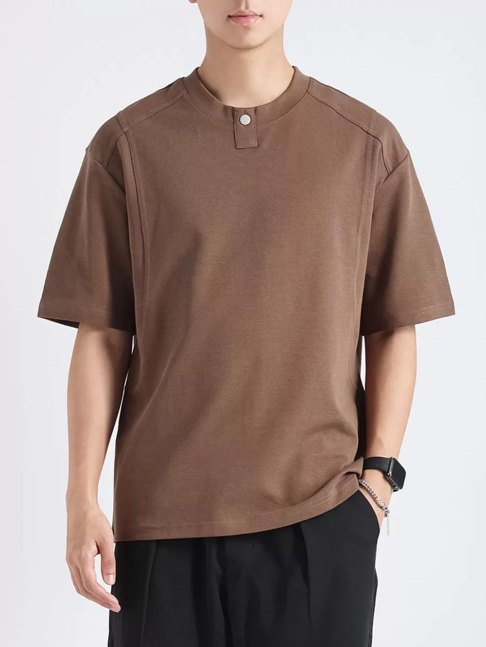 Men's brown cotton short sleeve tee with button detail at neckline.