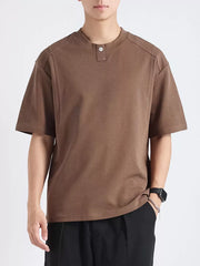 Men's brown cotton short sleeve tee with button detail at neckline.