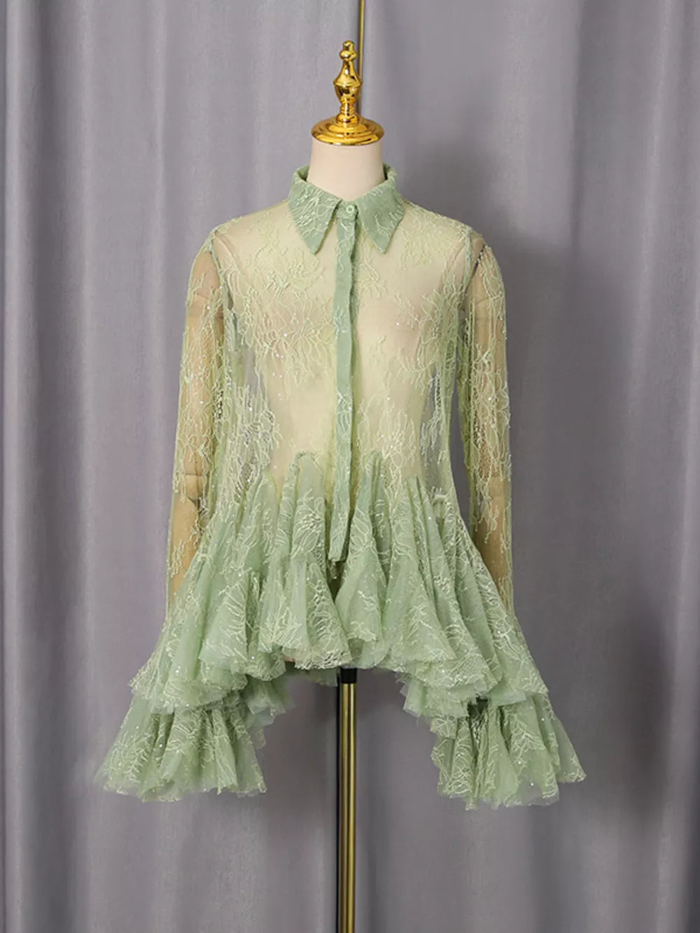Green floral lace dress with ruffled hem and buttoned front.