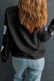 Black sweatshirt with holographic ghost graphics on sleeves.