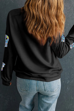 Black sweatshirt with holographic ghost graphics on sleeves.