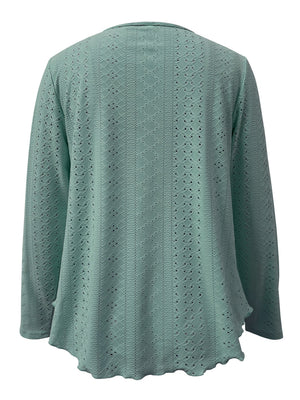 Light blue eyelet blouse with scalloped hem and long sleeves.
