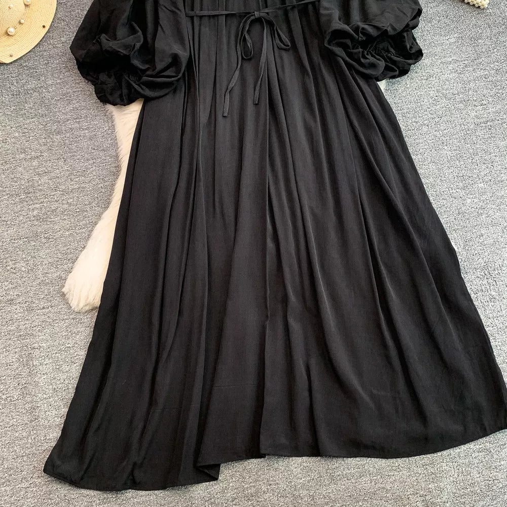 Black bohemian maxi dress with balloon sleeves and drawstring waist