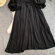 Black bohemian maxi dress with balloon sleeves and drawstring waist