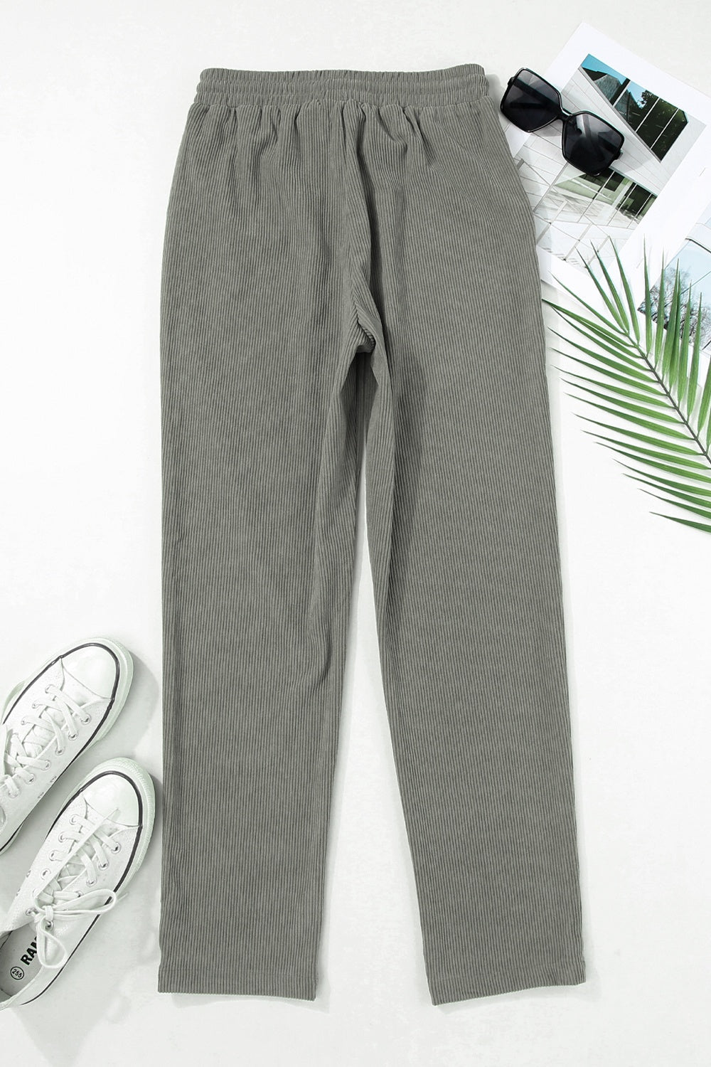 Corduroy drawstring trousers in dark gray with a relaxed fit and slant pockets.