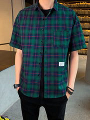 Men's green plaid short sleeve button-down shirt with chest pocket