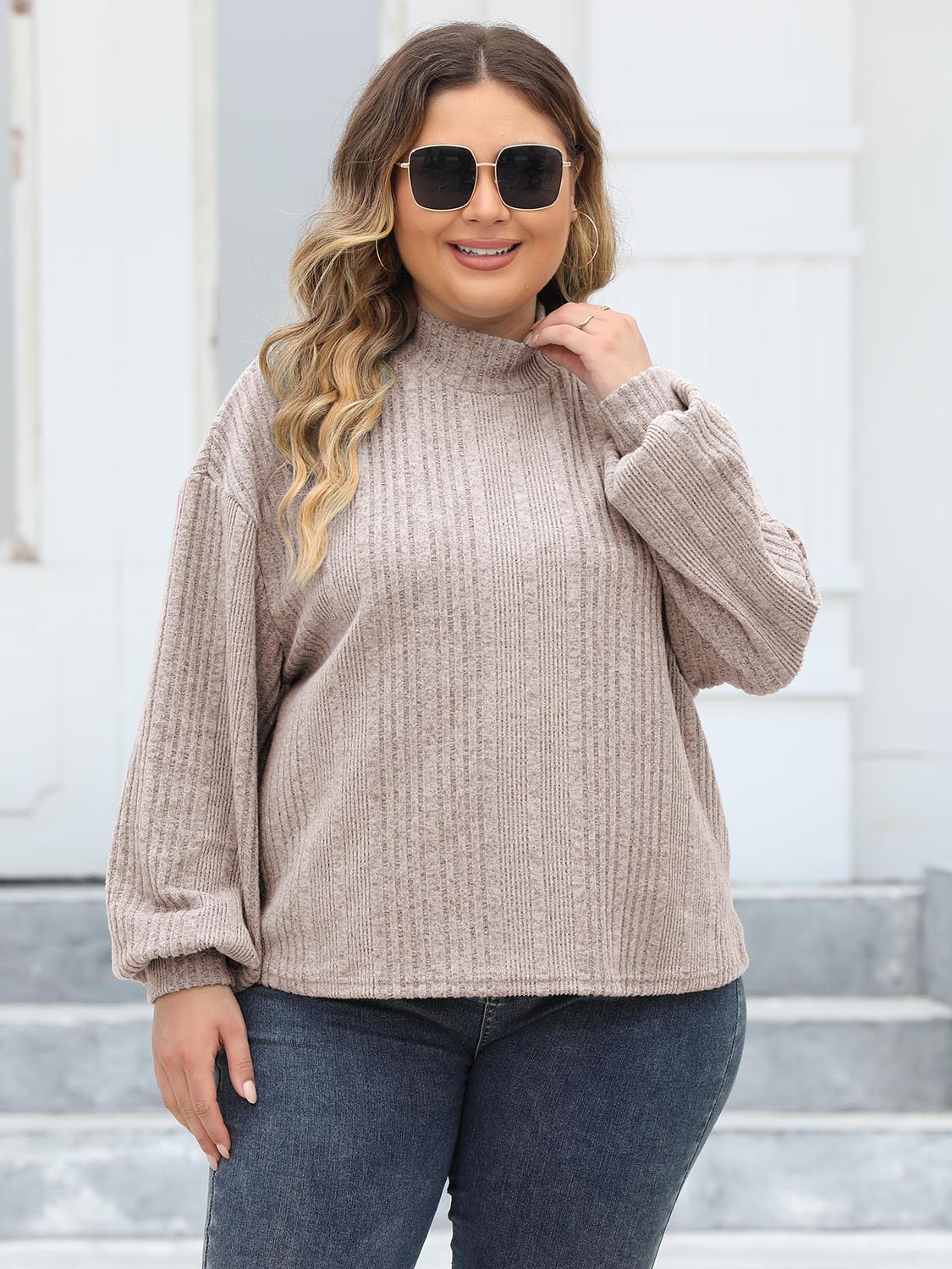 Beige ribbed knit sweater with mock neck and balloon sleeves