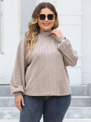 Beige ribbed knit sweater with mock neck and balloon sleeves
