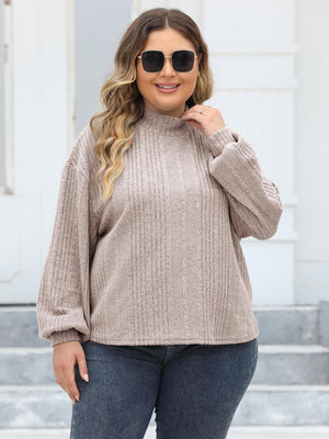 Beige ribbed knit sweater with mock neck and balloon sleeves
