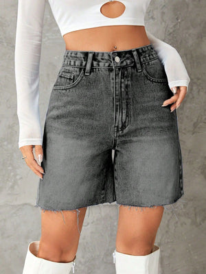 High-waisted denim Bermuda shorts in dark gray with frayed hem.
