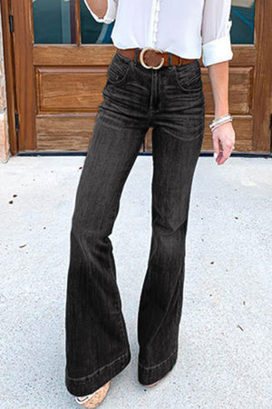Black denim bell bottom jeans with a high waist and button closure.