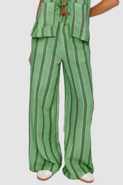 Green striped linen co-ord set with bow-tie back detail and wide-leg pants.