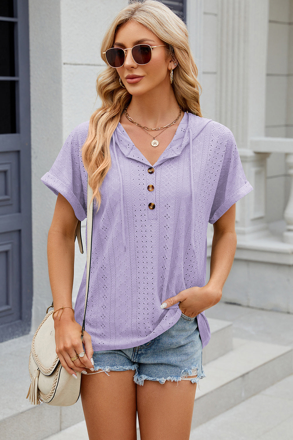 Lavender perforated henley hooded tee with short sleeves and button detail.