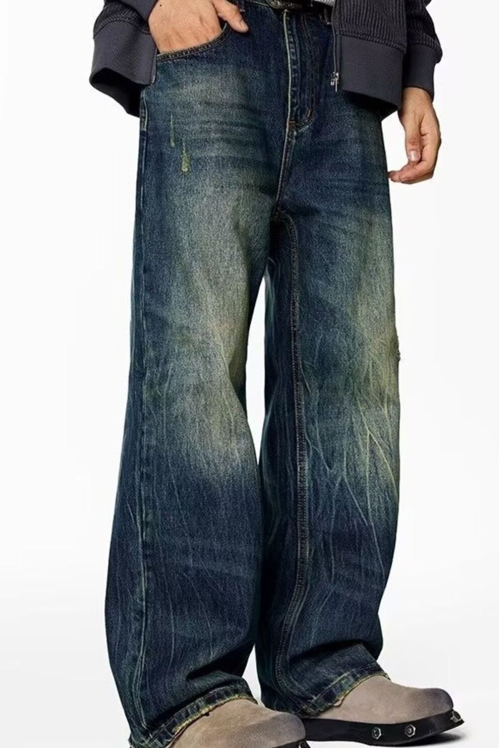 Men's wide-leg jeans in vintage blue wash cotton with distressed details.