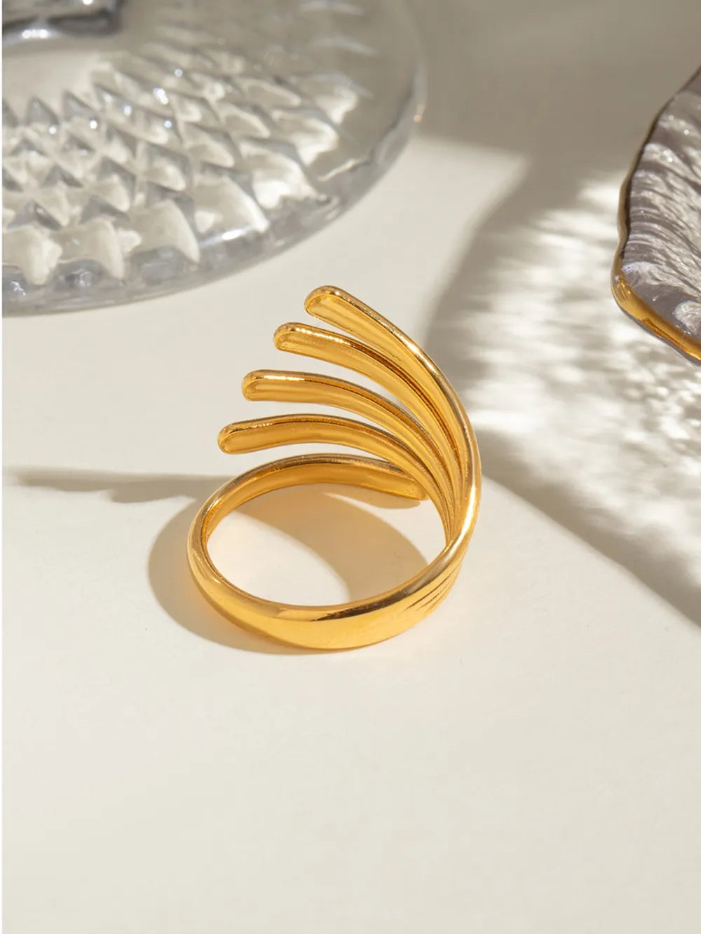 Gold plated ribbed ring with sculptural open design