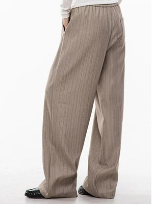 Khaki pinstripe wide-leg pleated trousers with drawstring waist for men.