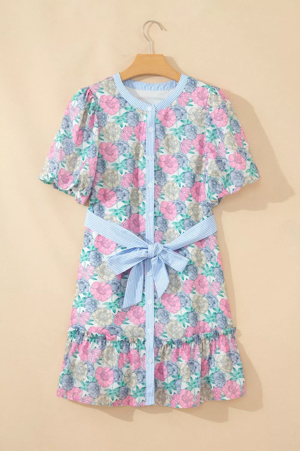 Floral mini dress with contrast trim, button front, puff sleeves, and belted waist.