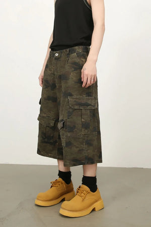 Camo culotte cargo shorts in green camouflage with multiple pockets.