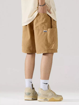 Khaki 100 cotton relaxed fit cargo shorts with adjustable drawstring and side pocket detail.