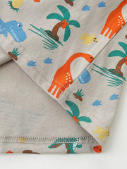 Toddler crew-neck tee in grey cotton with a playful dinosaur and palm tree print.