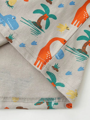 Toddler crew-neck tee in grey cotton with a playful dinosaur and palm tree print.