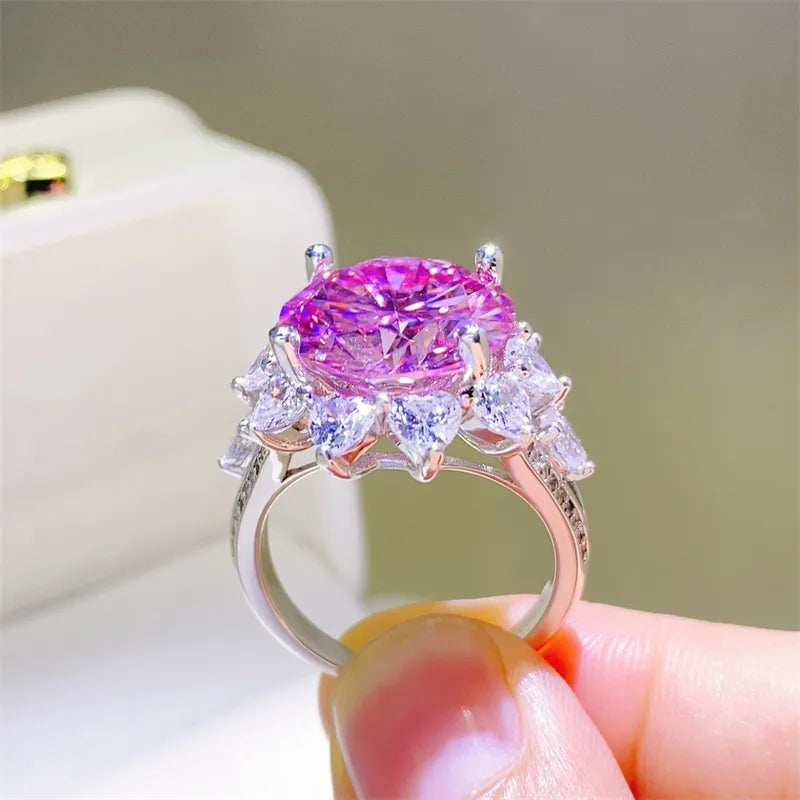 Radiant Blossom cocktail ring in silver with a large pink center stone and surrounding white stones.