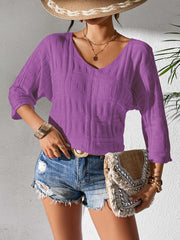 Textured knit dolman sleeve top in Vivid Violet with a V-neckline and 3/4 sleeves.