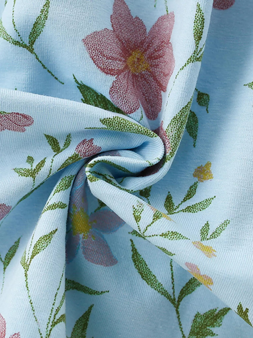 Light blue ribbed knit baby dress with a floral print and ruffled details.